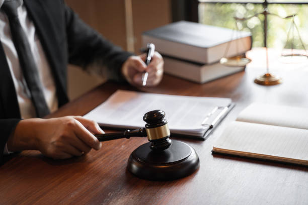 istock lawyer consulting with client discussing about contract. 1245602601