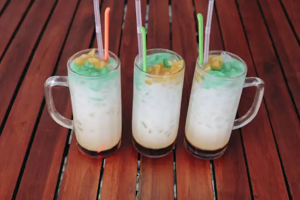 Photo of Es Cendol, Java traditional drink. Cendol is an iced sweet popular dessert that contains droplets of worm-like green rice flour jelly, coconut milk and palm sugar syrup