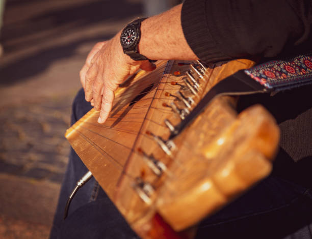 istock Man playing zither musical instrument, street performance 1245624490