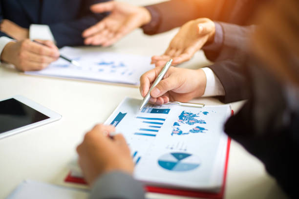 istock Business group or business partners discussing documents and ideas at meeting 1245643273