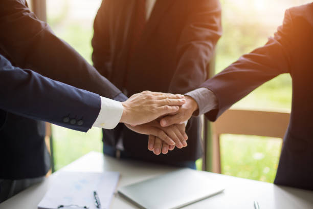 istock Business group or business partners discussing documents and ideas at meeting 1245644339