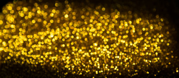 istock Background golden bokeh dust, blur effect 1245645120