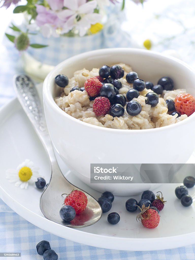 Porridge Oatmeal porridge with blueberry for breakfast Berry Fruit Stock Photo