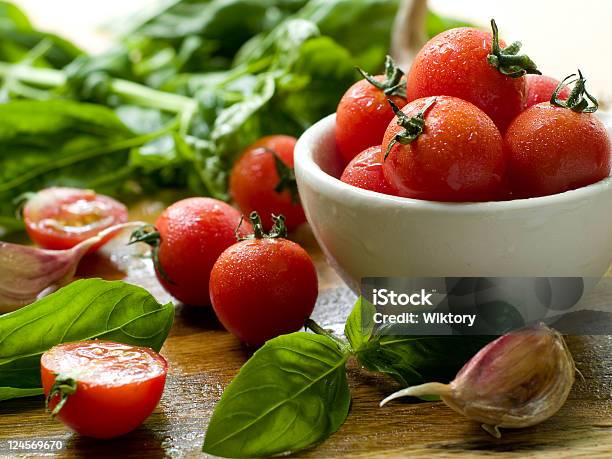 Cherry Tomatoes Stock Photo - Download Image Now - Basil, Bowl, Cherry Tomato