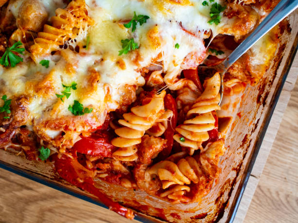 Pasta casserole with barbecue chicken breast, cheese and vegetables Pasta casserole with barbecue chicken breast, cheese and vegetables pasta casserole stock pictures, royalty-free photos & images