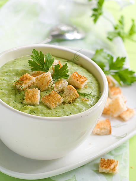 istock Pea soup with croutons and garnish on top in a white dish 124572148