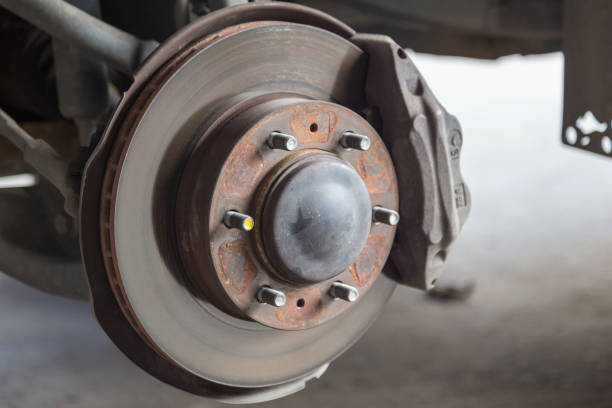 istock Closeup of car disc brake at car workshop-Technical concept 1245736383