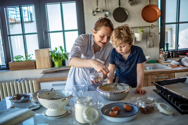istock Mother and son making a Cake together 1245763928