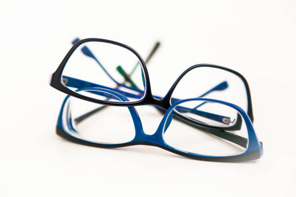 istock Two pairs of glasses or eyewears in blue frame on white background 1245767652