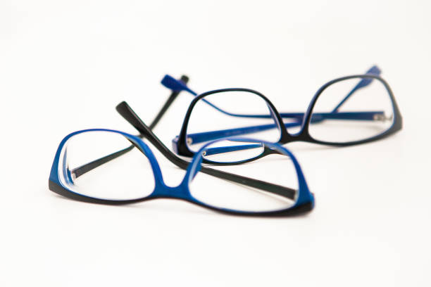 istock Two pairs of glasses or eyewears in blue frame on white background 1245767802