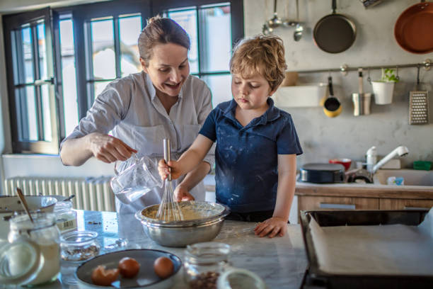 istock Mother and son making a Cake together 1245772670