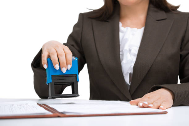 businesswoman Putting Stamp On Documents. isolated businesswoman clerk Putting Stamp On Documents, isolated on white background shorthand stock pictures, royalty-free photos & images