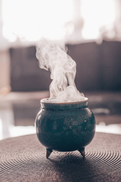 istock Frankincense burning on a hot coal. Frankincense is an aromatic resin, used for religious rites, incense and perfumes, incense smoke (color toned image) 1245793175