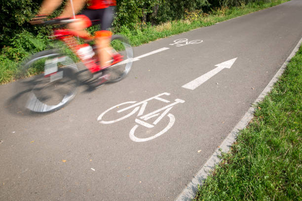 istock Cyclist on a road bike / bike path going fast (motion blur technique is used to convey movement; colour toned image) 1245794242