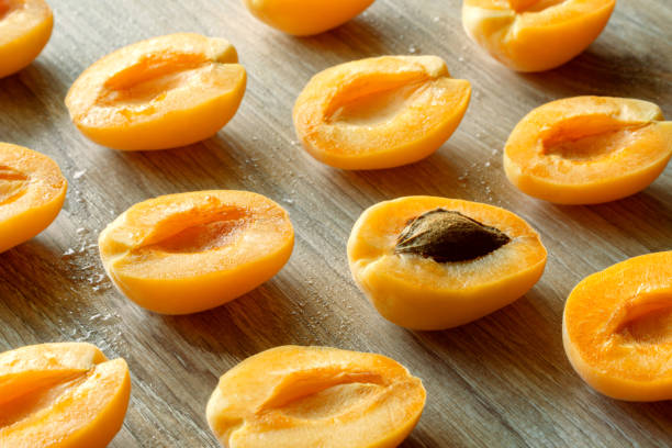 istock apricot halves pattern on gray wooden background 1245821247