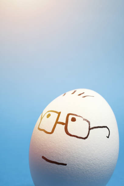 istock Drawing of Optimistic Facial Expression on an Egg with Blue Background. 1245822873
