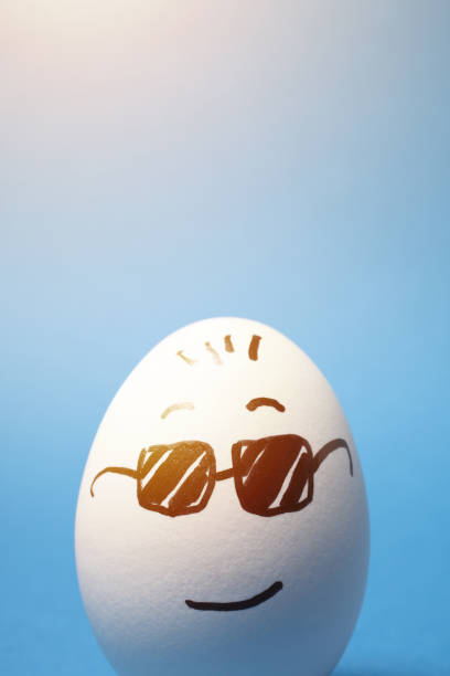 istock Drawing of Cool Face with Sunglasses on an Egg with Blue Background 1245822878