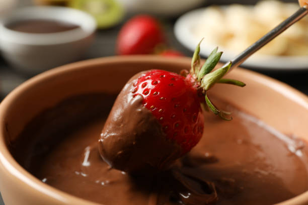 istock Strawberry in chocolate, close up. Chocolate fondue 1245842100