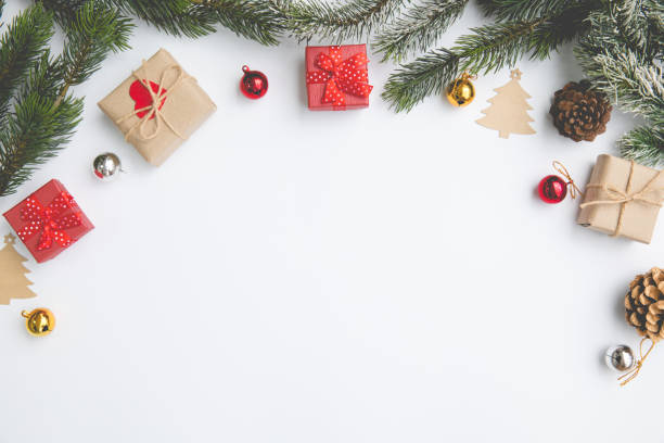 istock Christmas desk white table overhead place layout emty for insert font picture and around decorations accessories bell gift limb pine 1245855633