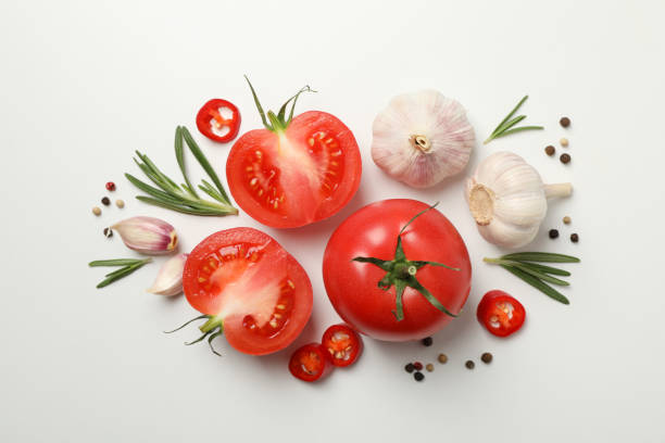 istock Tomatoes and ingredients on white background, top view 1245857790