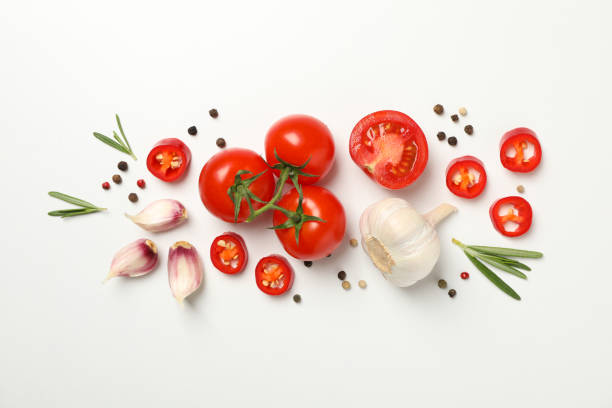 istock Tomatoes and ingredients on white background, top view 1245859373