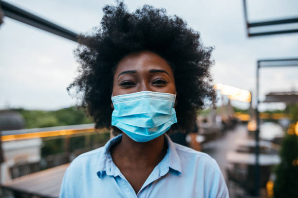 Young businesswoman wearing protective mask