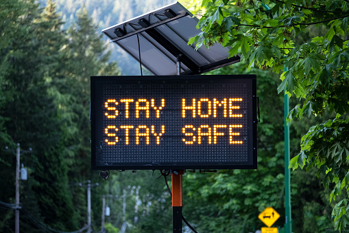 Solar Powered Stay Home Stay Safe Road Sign photo