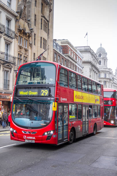 Modern red double decker bus in the center of the city, London, England London, England - December 18, 2016: Modern red double decker bus in the center of the city. Double-decker buses are in common use throughout the United Kingdom. boris bus stock pictures, royalty-free photos & images