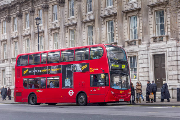 Modern red double decker bus in the center of the city, London, England London, England - December 18, 2016: Modern red double decker bus in the center of the city. Double-decker buses are in common use throughout the United Kingdom. boris bus stock pictures, royalty-free photos & images