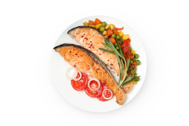 istock Plate with grilled salmon isolated on white background 1245889869