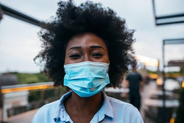 istock Young businesswoman wearing protective mask 1245890497