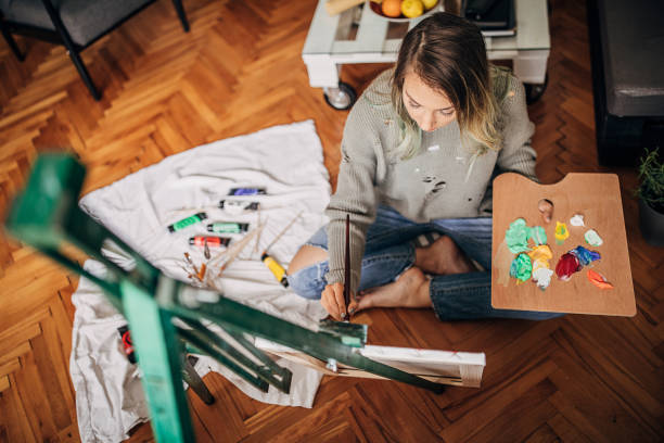 istock Creative woman painting on the floor 1245892245