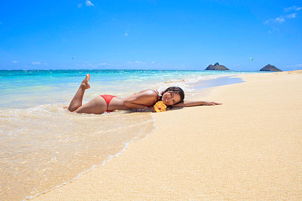 Woman in swimwear enjoy in shallow sea  on sunny summer day
