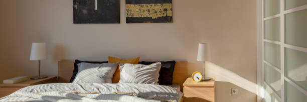 istock Stylish bedroom in morning sunlight, panorama 1245898730