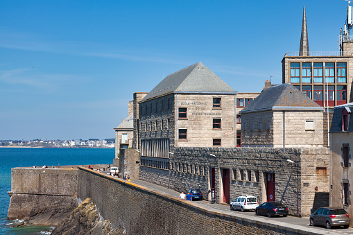 Saint-Malo, France - June 02 2020: The bastion called Fort La Reine next to the National Merchant Marine School (French: École nationale de la marine marchande).