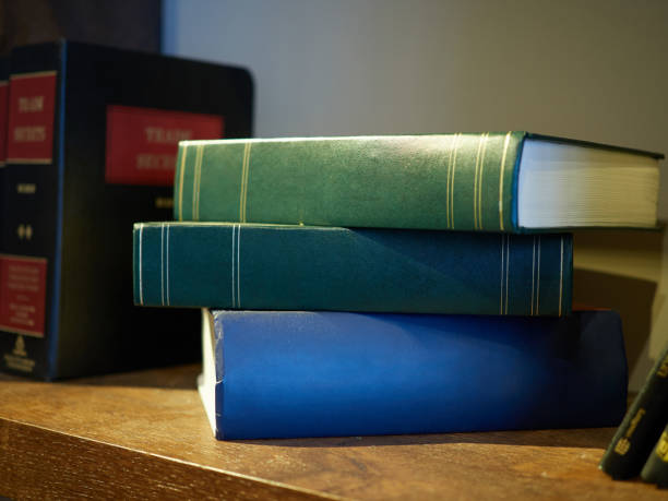 istock Three books stacked on an antique shelf 1245908219