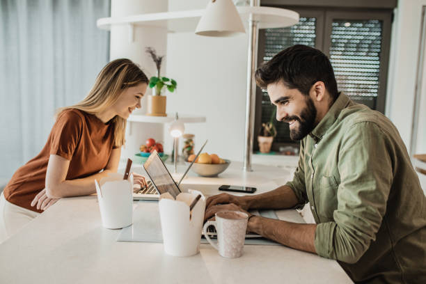 istock A young couple working from home on their laptops 1245909545