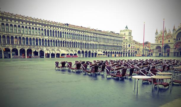 istock Venice submerged by high tide and water in Saint Mark Square wit 1245909722