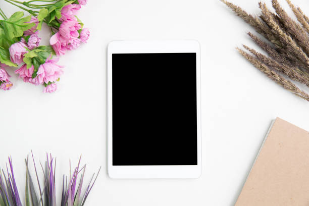 istock Office Desk tablet table work space top view overhead above present advertising product on screen isolated 1245912592