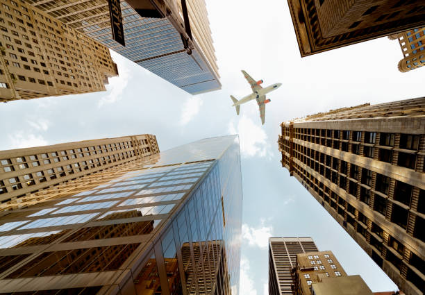 istock Airplane flying over skyscrapers, NYC. 1245912601
