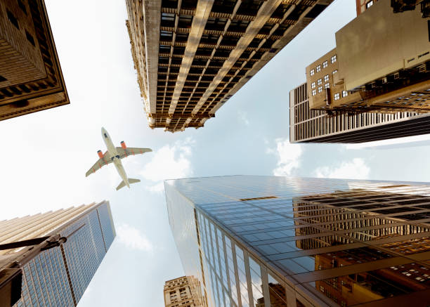 istock Airplane flying over skyscrapers, NYC. 1245912625