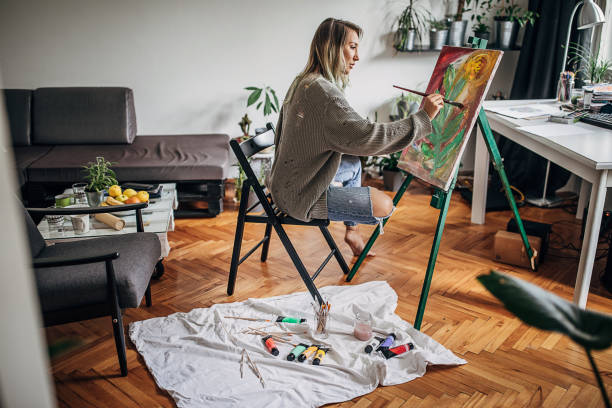 istock One beautiful woman painting in her home studio 1245912626