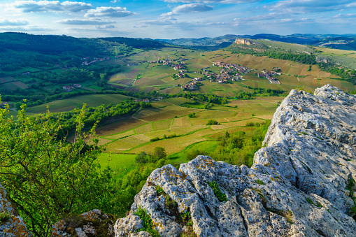 Landscape of vineyards and countryside, viewed from the Rock of Solutre (la roche), in Saone-et-Loire department, Burgundy, France