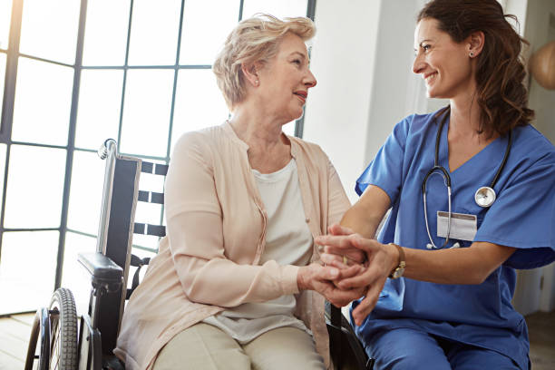 Thank you for every thing Cropped shot of a female nurse talking to a senior patient in the retirement home hospice photos stock pictures, royalty-free photos & images