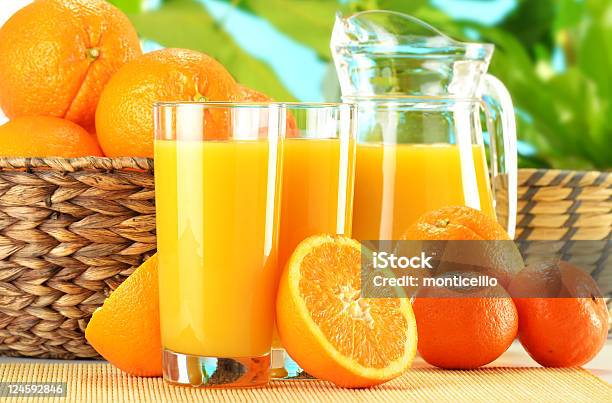 Composition With Two Glasses Of Orange Juice And Fruits Stock Photo - Download Image Now