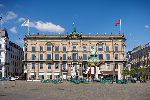 Kongens Nytorv, Copenhagen, Denmark, May 29, 2020: Old classical house at a square in Copenhagen, which is home to some of the most expensive addresses in the city