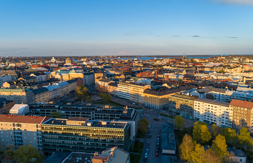 This pic shows Aerial view of Helsinki city and its downtown. Rooftop buildings and cityscape is seen in the pic.