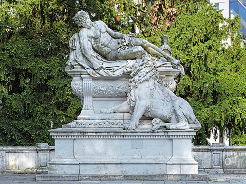 Dusseldorf, Germany - May 20, 2015: War Memorial in the Hofgarten park. The memorial is dedicated to Dusseldorf's soldiers fallen in German Unification Wars of 1864-1866 and Franco-Prussian War of 1870. It was created by the German sculptor Karl Hilgers, and unveiled on October 18, 1892.