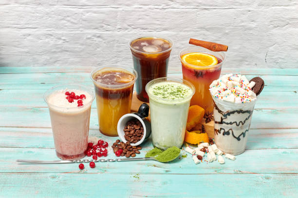 istock still life with beautiful drinks on a light blue background. coffee and milk cold drinks for the cafe menu in summer. various delicious refreshing drinks in transparent plastic glasses 1245946643