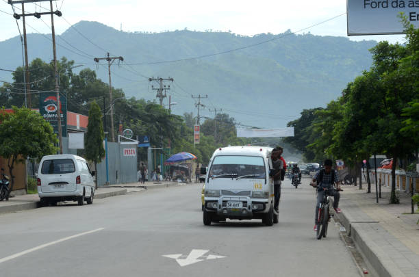 Dili, Timor Leste - February 5, 2012: Taxi passing on the highway Dili, Timor Leste. Transportation in the small country of 1.1 million people, has not had a good transportation system.